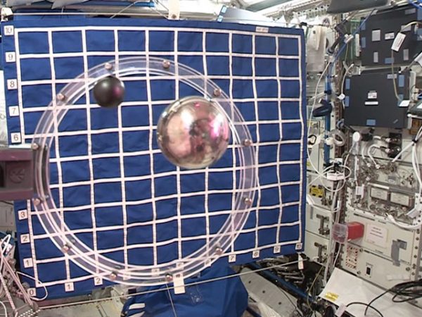 2 balls in circular track air resistance